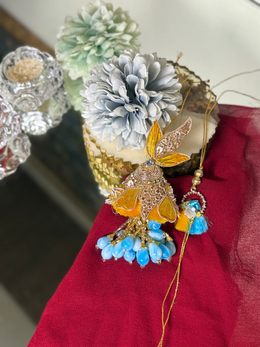 Yellow Heavy Rakhi With Blue Droppings Pair