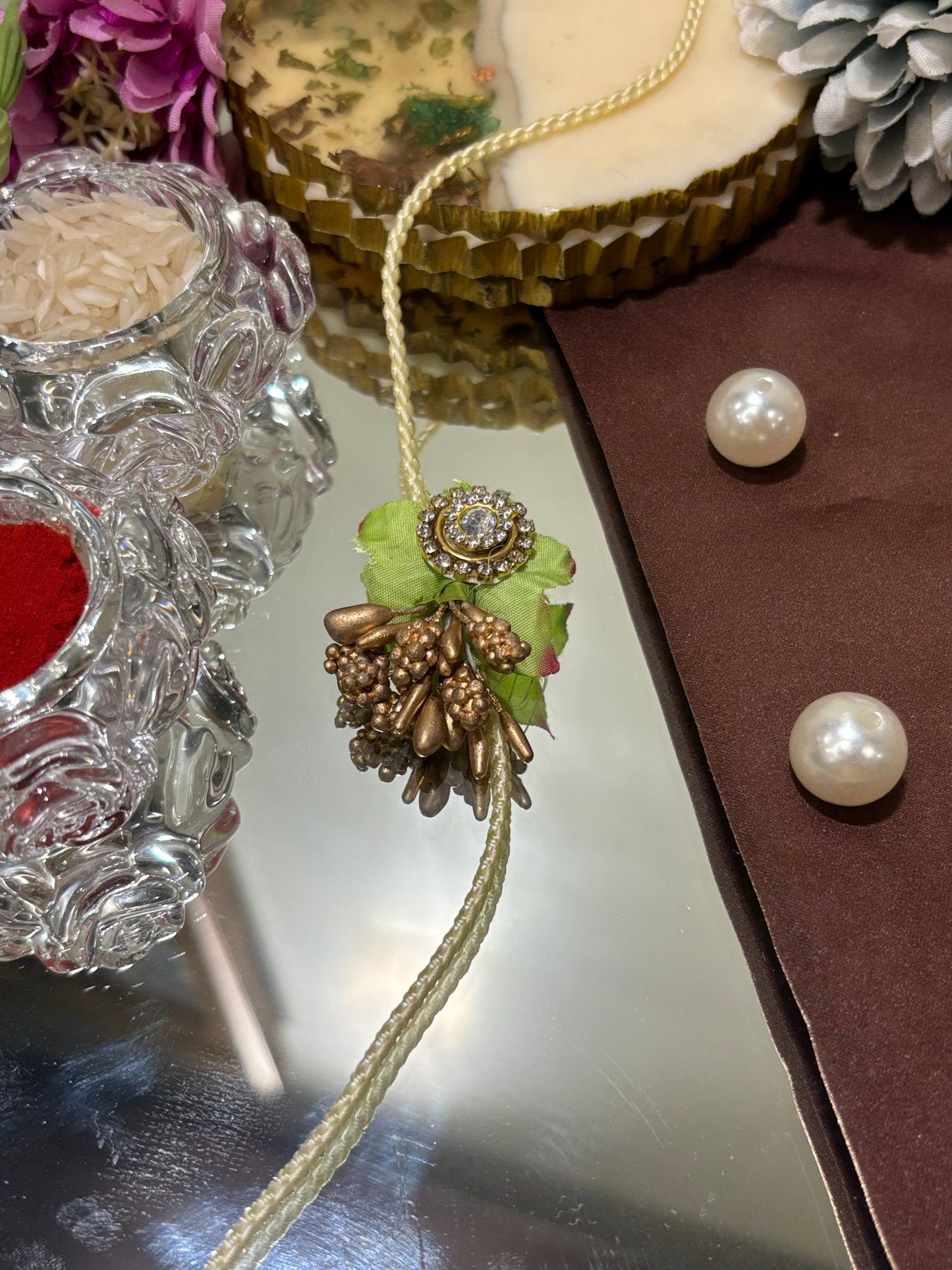 Green Rakhi With Golden Buds