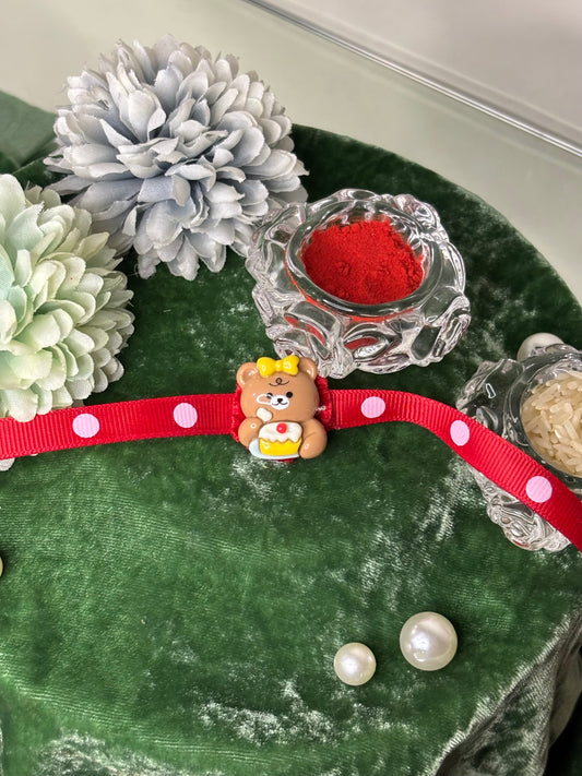 Cake Eating Teddy Rakhi in Red Strap